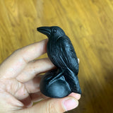 Obsidian crow carving